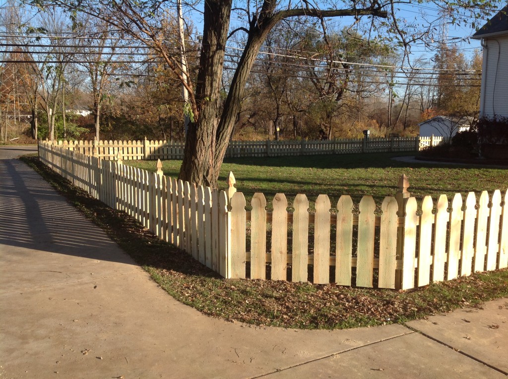  3 foot high pressure treated spaced picket fence. Gothic top pickets and posts.